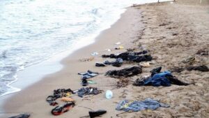Migrants' wet clothes discarded on a beach in Bodrum, Turkey, in 2015. Photo/ International Organization for Migration.